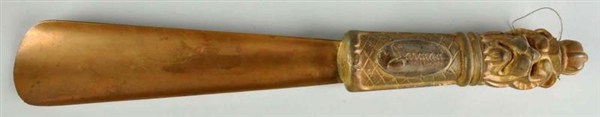 FIGURAL SHOEHORN WITH CARVING & ADVERTISING.      