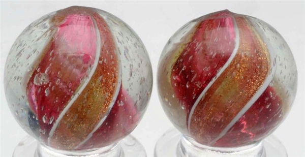 LOT OF 2: CRANBERRY RIBBON LUTZ MARBLES.          
