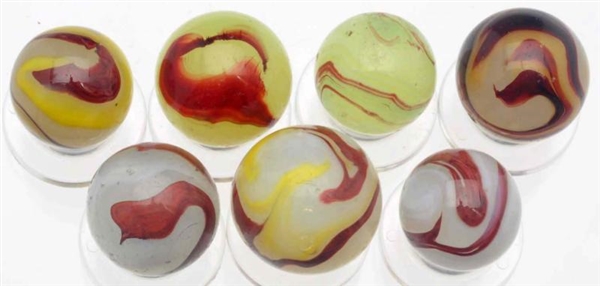 LOT OF 7: AKRO AGATE OXBLOOD MARBLES.             
