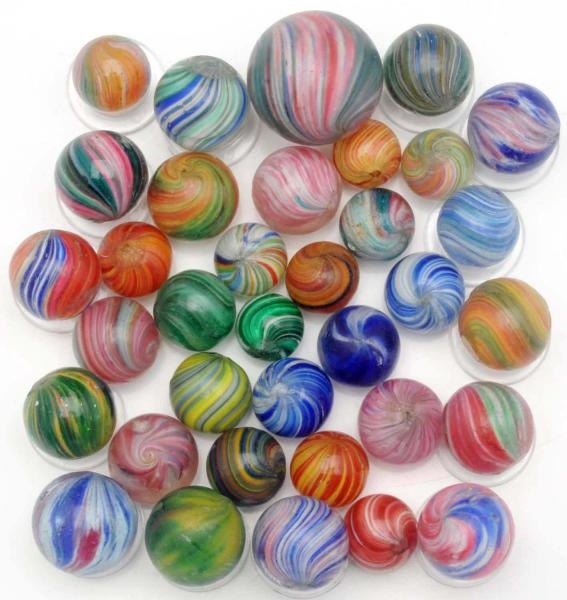 LOT OF APPROXIMATELY 35: HANDMADE MARBLES.        