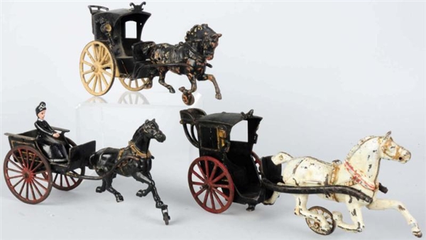 LOT OF 3: CAST IRON HORSE-DRAWN CARRIAGE TOYS.    