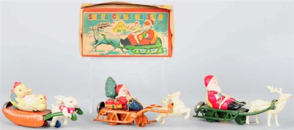 LOT OF 3: CELLULOID & TIN HOLIDAY WIND-UP TOYS.   