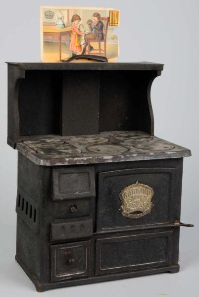 EARLY TIN GARLAND CHILDS TOY STOVE.              