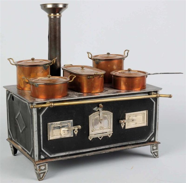 EARLY TIN CHILDS TOY STOVE.                      