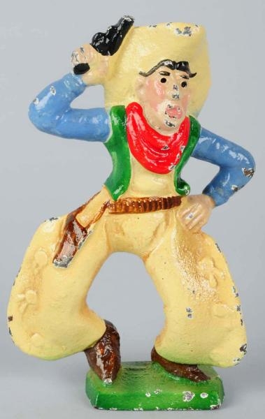CAST IRON COWBOY WITH SIX SHOOTER PAPERWEIGHT.    