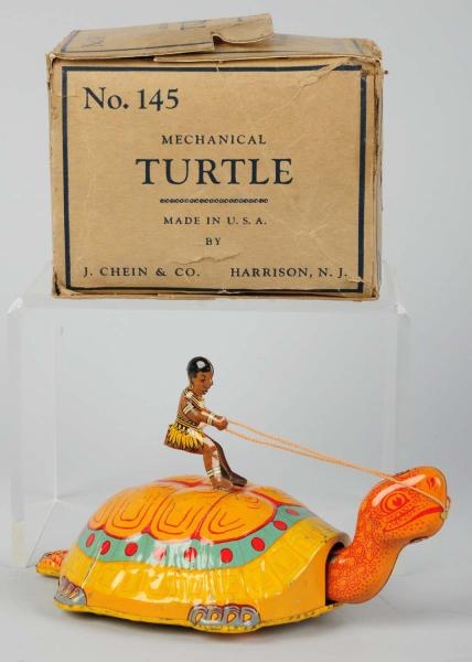 TIN LITHO CHEIN NATIVE RIDING TURTLE WIND-UP TOY. 