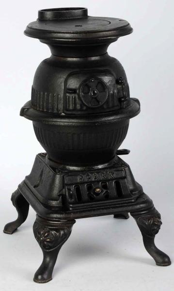 CAST IRON SPARK CHILDS STOVE TOY.                