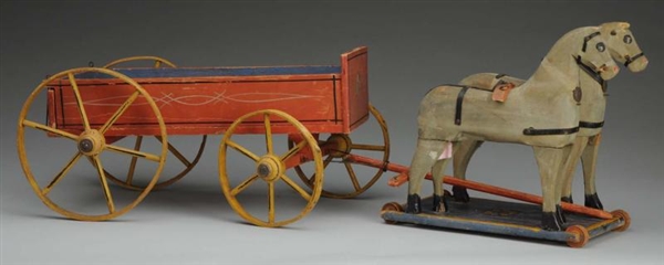 PAIR OF WOOD HORSES WITH WAGON.                   