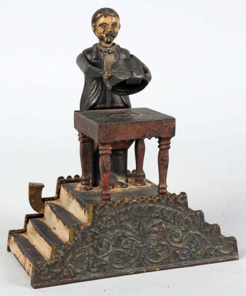 CAST IRON MAGICIAN MECHANICAL BANK.               