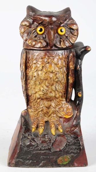 CAST IRON OWL TURNS HEAD MECHANICAL BANK.         