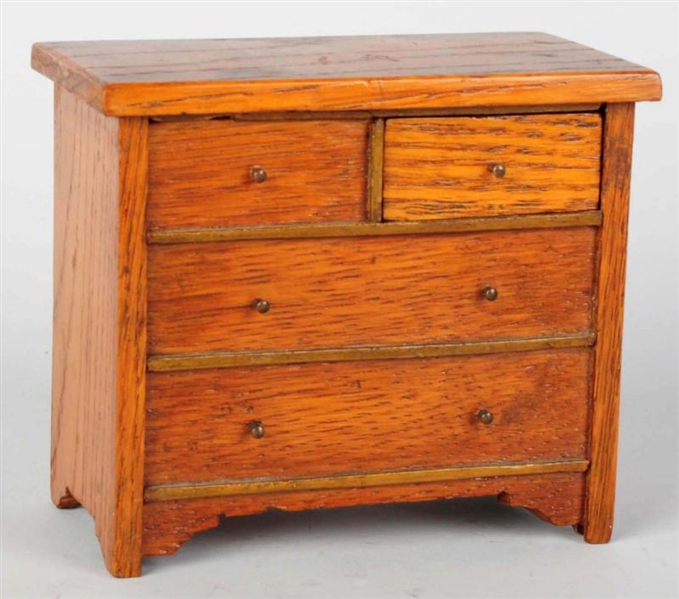 WOODEN CHEST OF DRAWERS MECHANICAL BANK.          