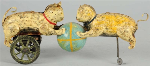 HAND-PAINTED TIN CATS & BALL WIND-UP TOY.         