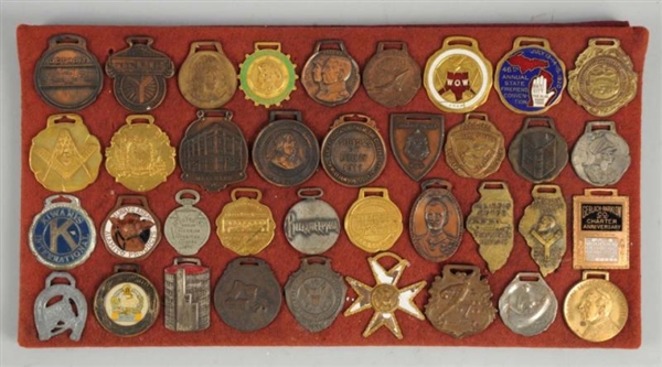 LOT OF 37: AMERICAN BADGE CO. SAMPLE WATCH FOBS.  
