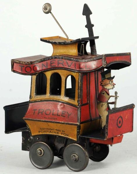 TIN LITHO TOONERVILLE TROLLEY WIND-UP TOY.        