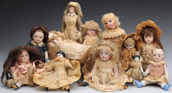 LOT OF 12: SMALL BISQUE DOLLS.                    