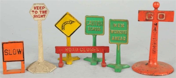 LOT OF 7: CAST IRON ARCADE ROAD SIGNS.            