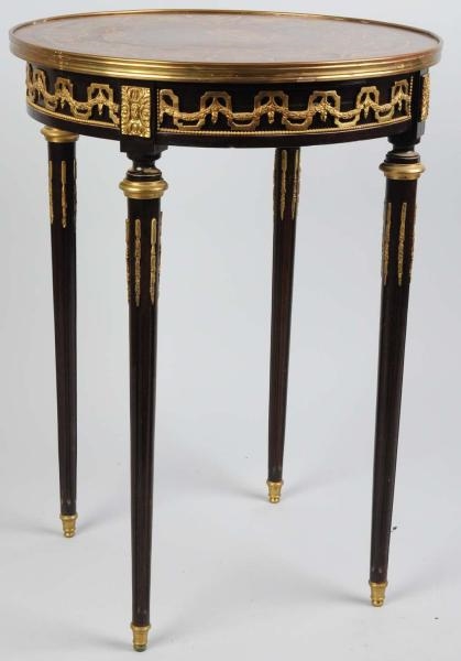 ROUND END TABLE WITH BRASS ORNAMENTS.             