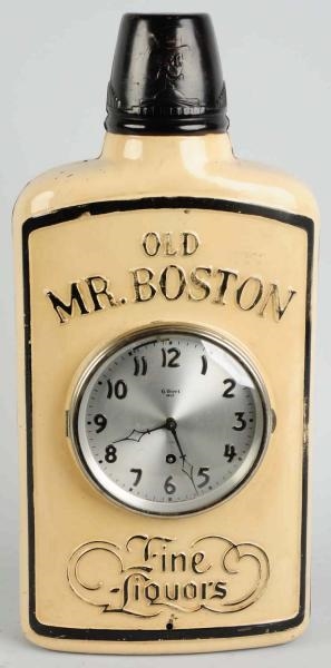 OLD MR. BOSTON EMBOSSED TIN BOTTLE/CLOCK DISPLAY. 