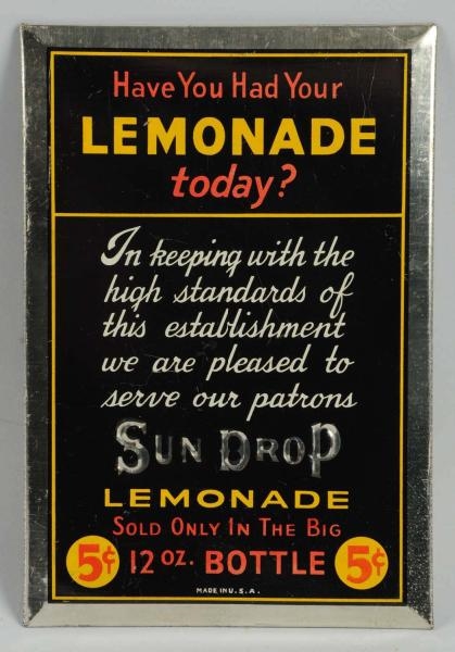 1930S SUN DROP LEMONADE TIN OVER CARDBOARD SIGN.  
