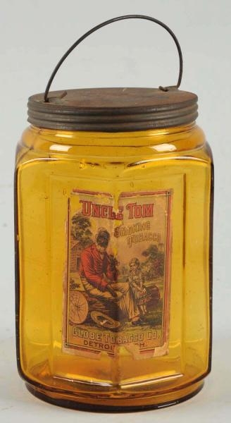 UNCLE TOM SMOKING TOBACCO JAR WITH PAPER LABEL.   