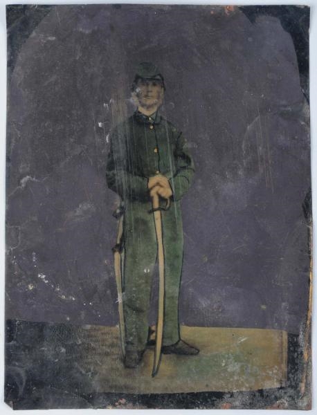 LARGE TIN TYPE OF CIVIL WAR SOLDIER WITH SWORD.   