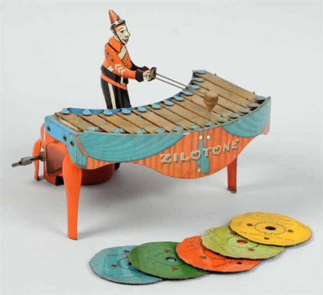 TIN LITHO WOLVERINE XYLOPHONE PLAYER WIND-UP TOY. 