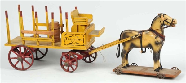 EARLY HORSE-DRAWN TRUCKING WAGON TOY.             