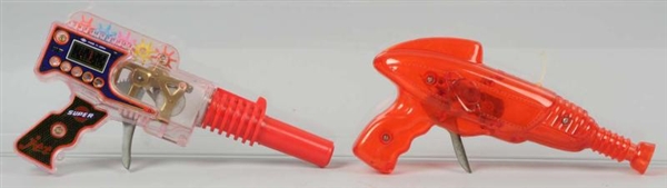 LOT OF 2: PLASTIC FRICTION TOY RAY GUNS.          