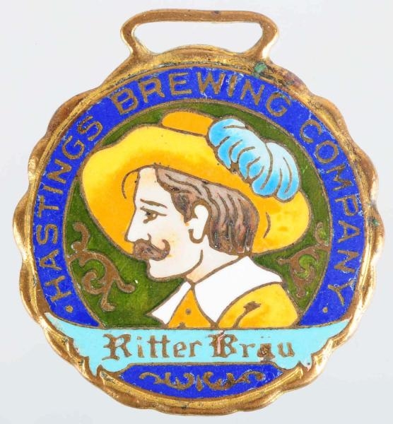 HASTINGS BREWING COMPANY ENAMELED PORTRAIT FOB.   