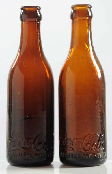 LOT OF 2: AMBER COCA-COLA STRAIGHT-SIDED BOTTLES. 