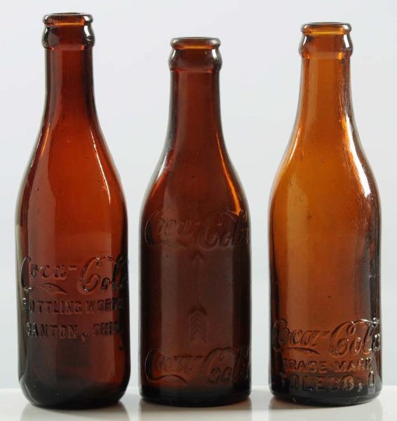 LOT OF 3: COCA-COLA AMBER STRAIGHT-SIDED BOTTLES. 