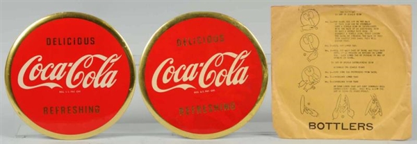 PAIR OF COCA-COLA CELLULOID DISCS WITH ENVELOPE.  