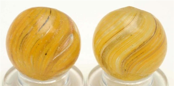 LOT OF 2: YELLOW ONIONSKIN LUTZ MARBLES.          