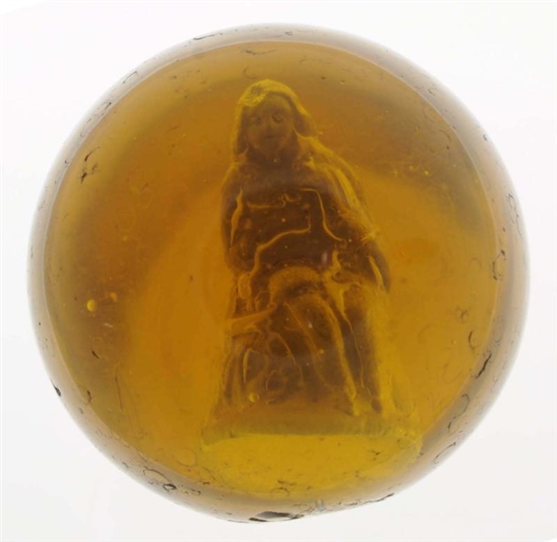 AMBER GLASS BOY WITH DUCK SULPHIDE MARBLE.        