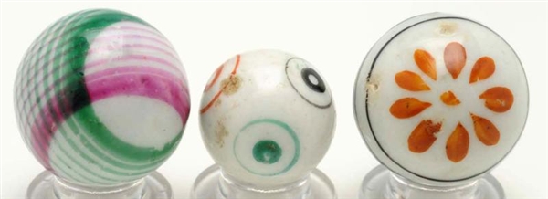 LOT OF 3: ASSORTED GLAZED CHINA MARBLES.          
