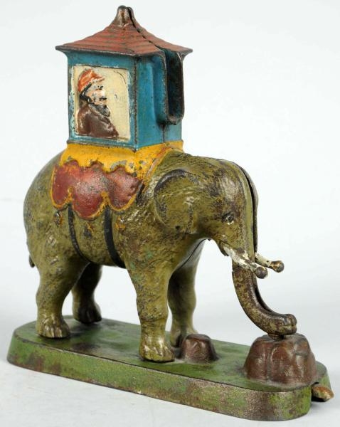 CAST IRON ELEPHANT WITH HOWDAH MECHANICAL BANK.   