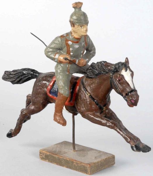 ELASTOLIN LANCER ON SPRINGING HORSE.              