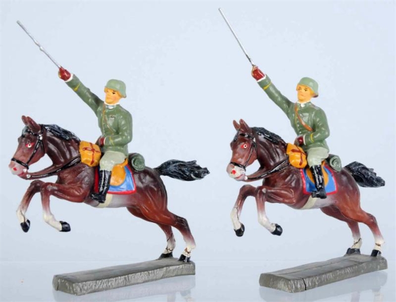 LOT OF 2: ELASTOLIN SOLDIERS ON CHARGING HORSES.  