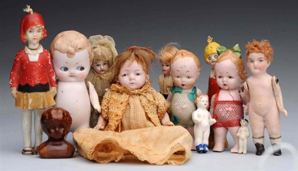 LOT OF 11: ALL-BISQUE GERMAN DOLLS.               