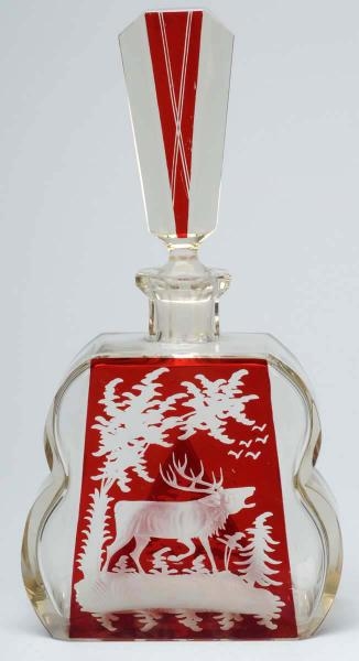 RUBY & CLEAR DECANTER WITH STAG DECORATION.       