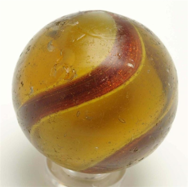 LARGE AMBER GLASS RIBBON LUTZ MARBLE.             