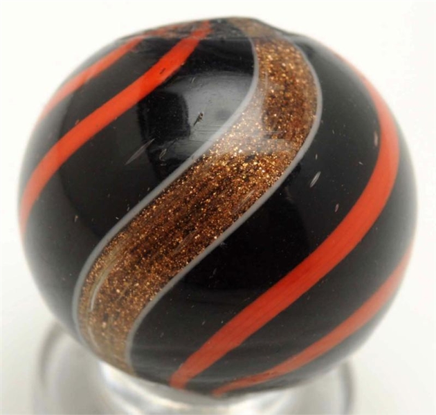 BLACK OPAQUE LUTZ MARBLE WITH ORANGE BANDS.       