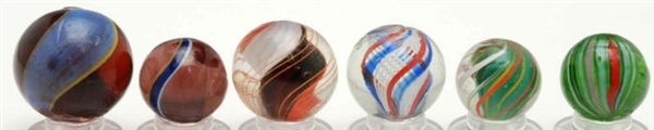 LOT OF 6: ASSORTED HANDMADE MARBLES.              
