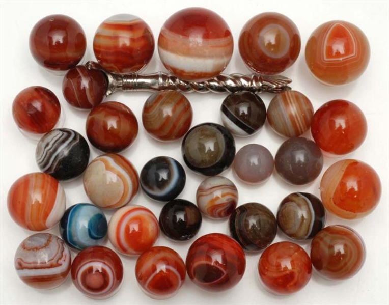 LOT OF 32: HAND-FACETED AGATE MARBLES.            