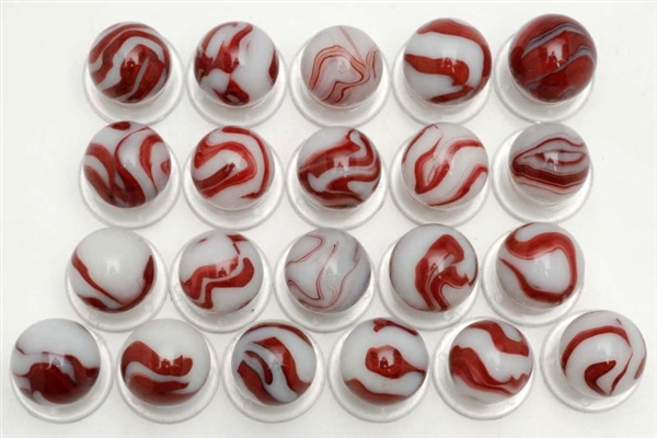 LOT OF 23: AKRO WHITE OXBLOOD MARBLES.            