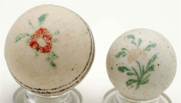 LOT OF 2: EARLY PERIOD FLOWER CHINA MARBLES.      