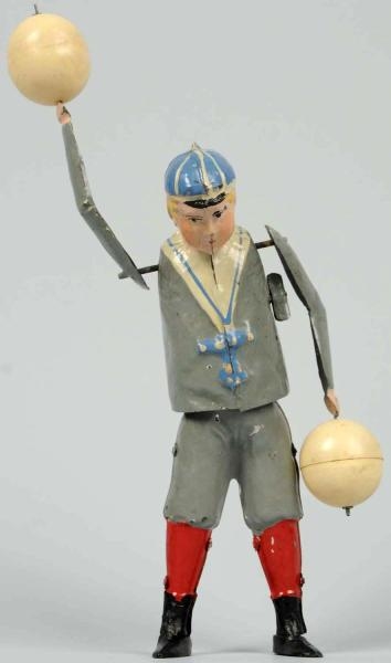 HAND-PAINTED TIN BALL PLAYING BOY WIND-UP TOY.    