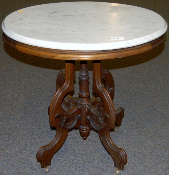 WALNUT OVAL MARBLE TOP TABLE.                     
