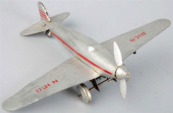 TIN LITHO RICO AIRPLANE WIND-UP TOY.              