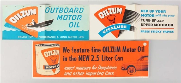 LOT OF 3: OILZUM 1960S PAPER SIGNS.               